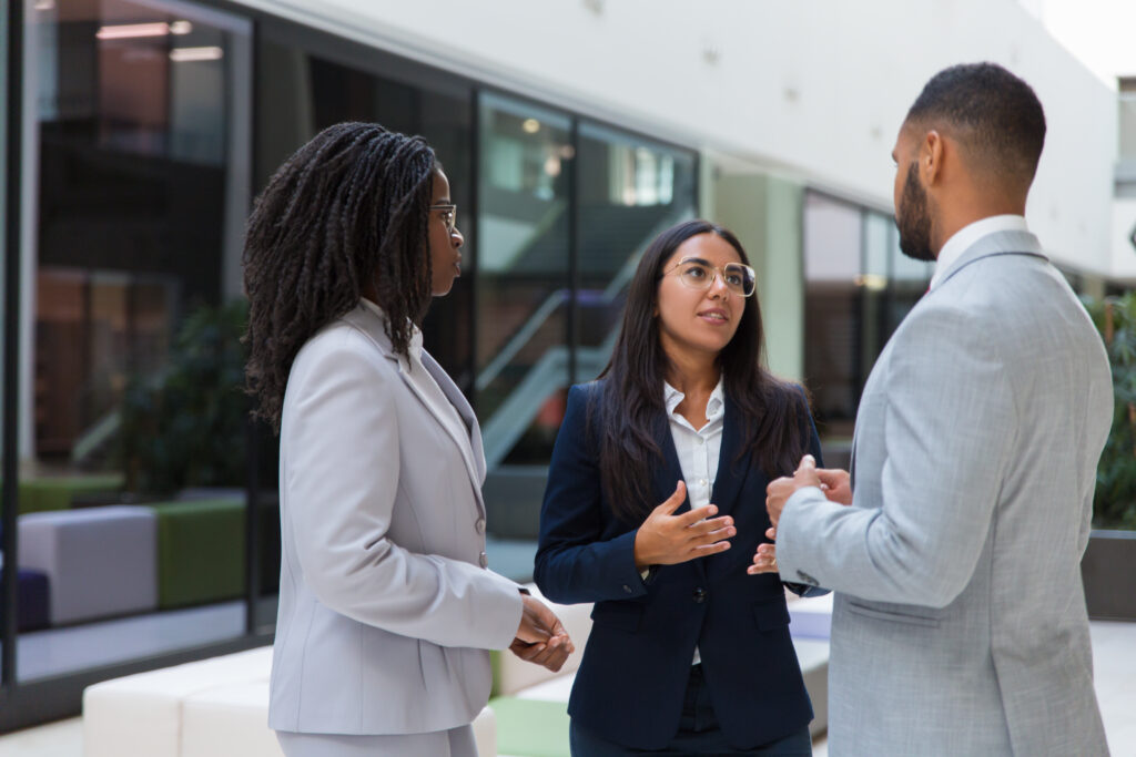 confident female agent telling customers about project