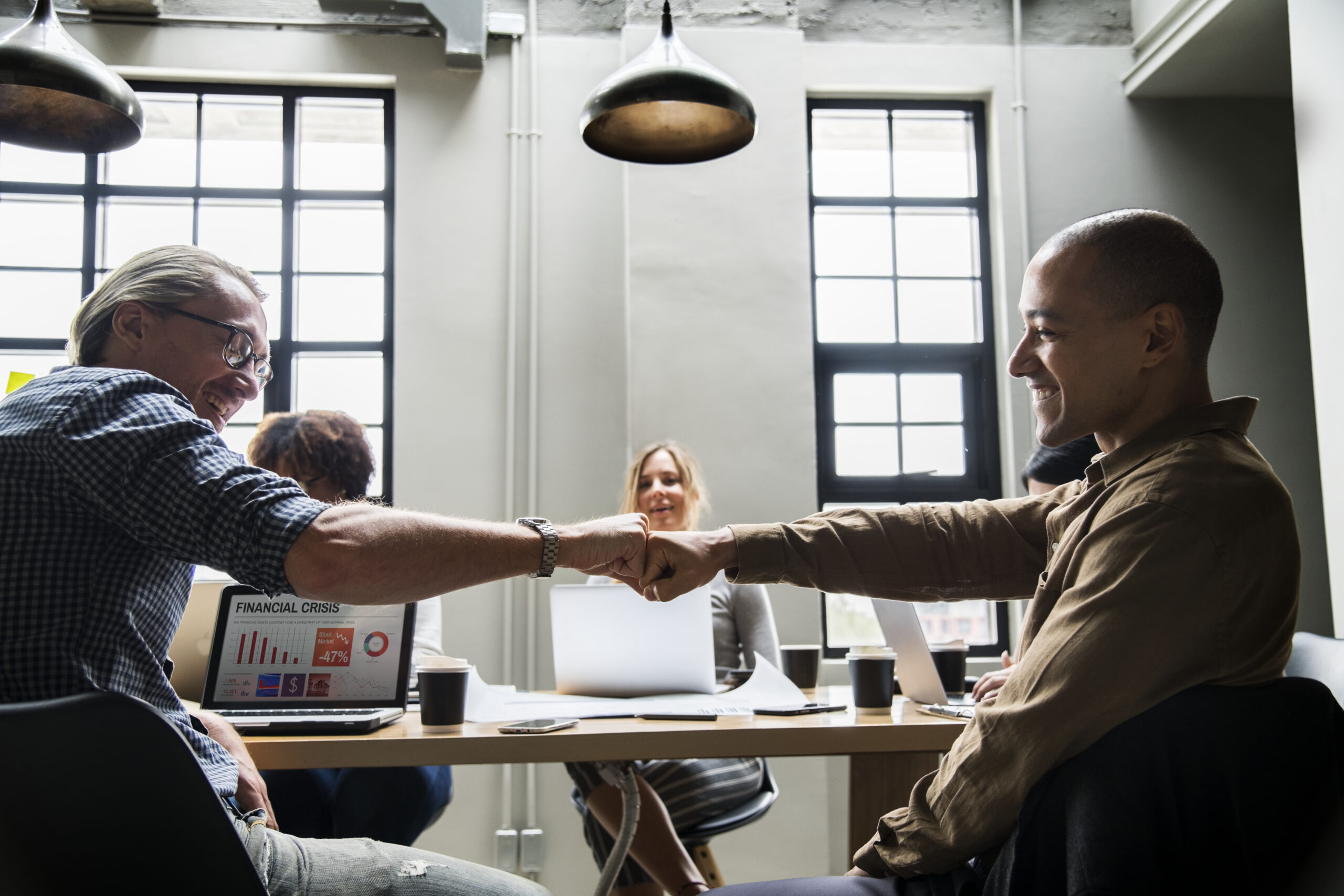 two people giving a fist bump