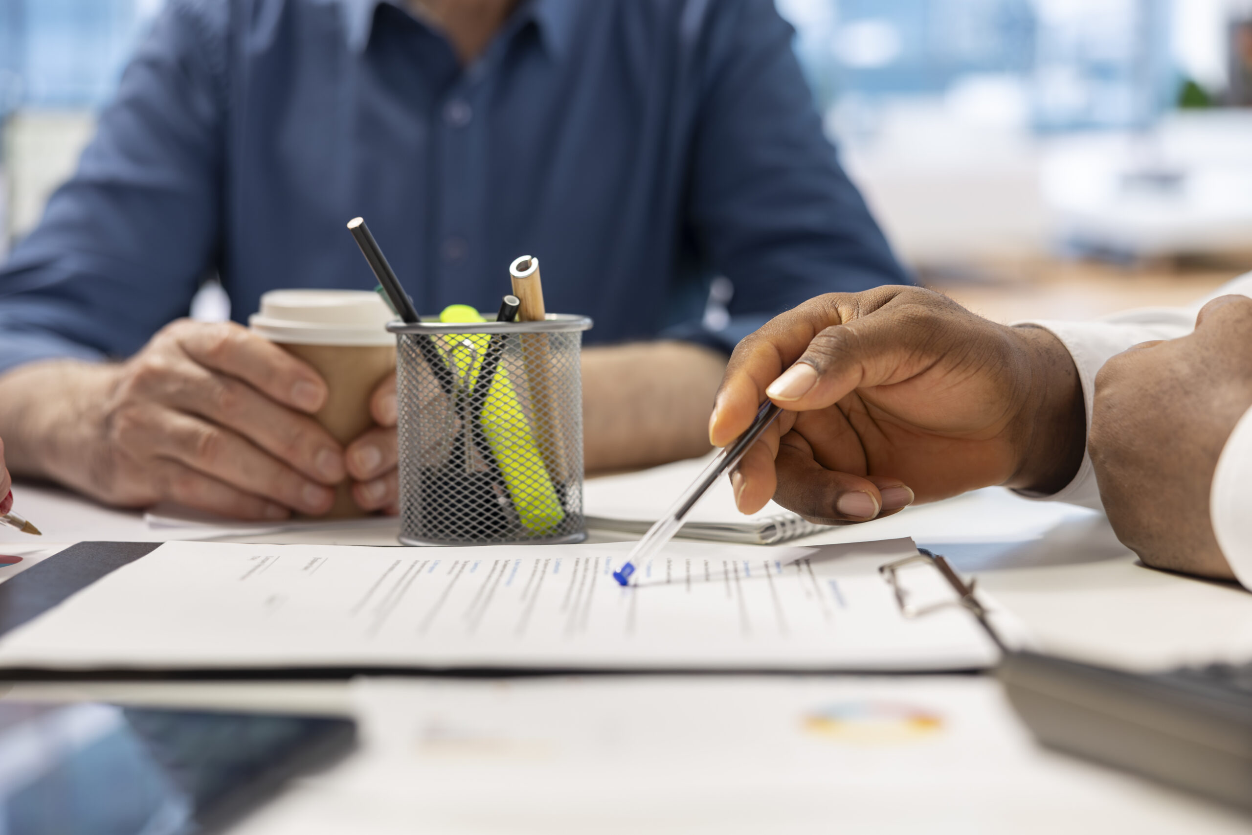 senior people reading retirement plan contract terms with broker